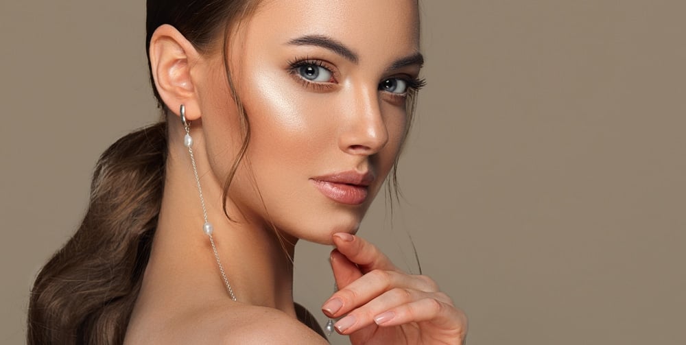 Portrait of a woman with smooth, glowing skin.