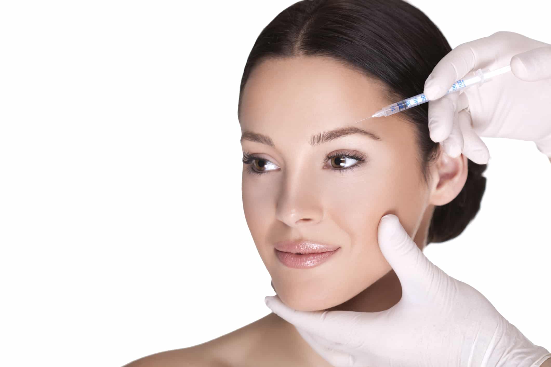 Dr. Philip R. Rizzuto performing an injectable treatment on a woman